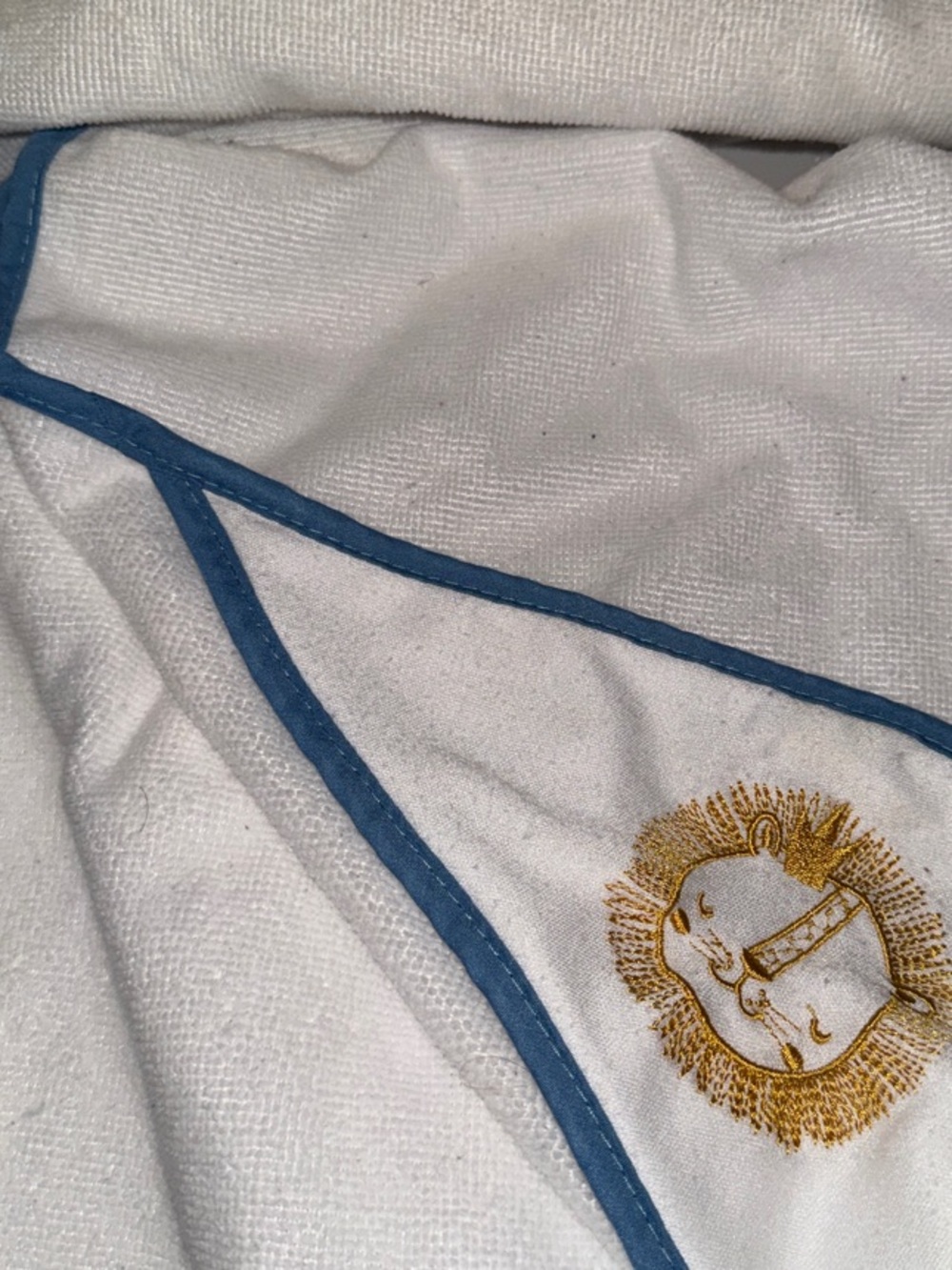 4 White Baby Hooded Towel with Blue Trim and Embroidered Lion